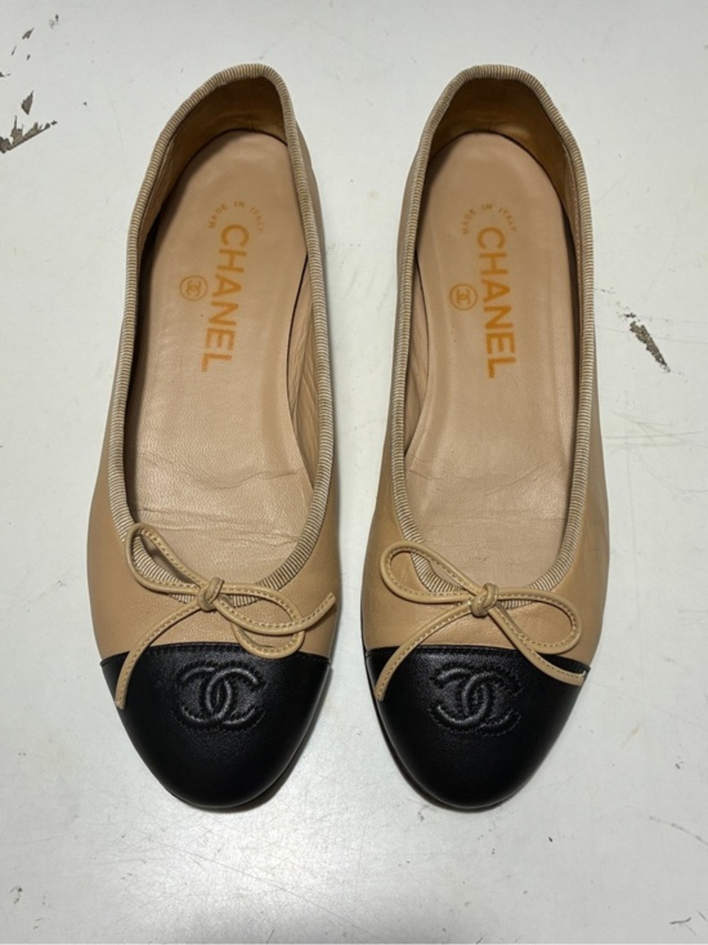 CHANEL Beige and Black Two-Tone Cap-Toe Ballet Flats